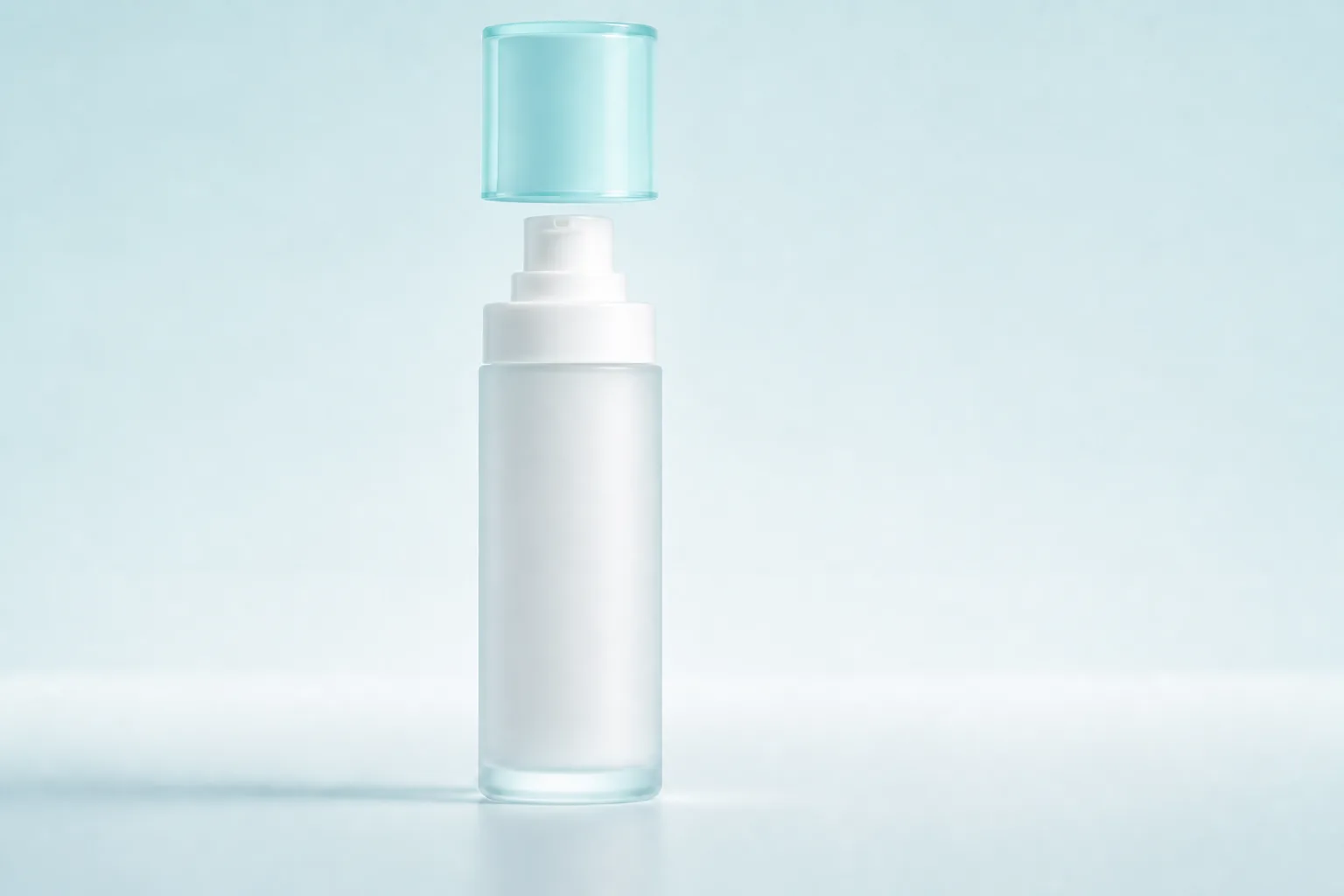 The same lotion bottle with its aqua cap fully lifted